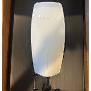 Tesla wall charger. Brand new in box. Did not end up buying car. Retail $425.